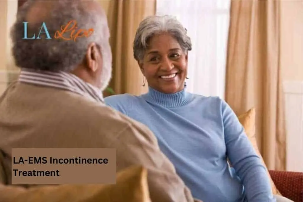 Couple sat smiling at each other - LA-EMS treatment Farnborough